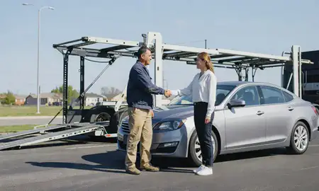 Vehicle owner beside their delivered car in Joliet, Illinois, United States