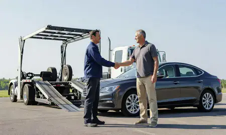 Vehicle owner beside their delivered car in Mount Prospect, Illinois, United States