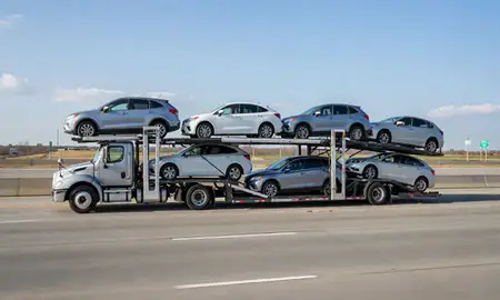Multi-level car carrier on the highway to Rockford, Illinois, United States