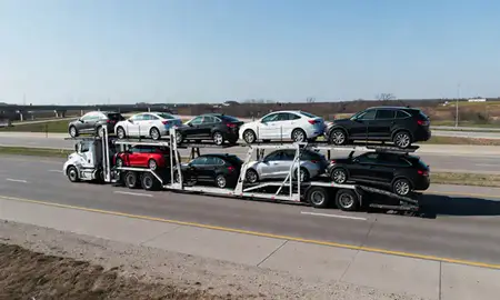 Multi-level car carrier on the highway to Springfield, Illinois, United States