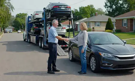 Vehicle owner beside their delivered car in Springfield, Illinois, United States