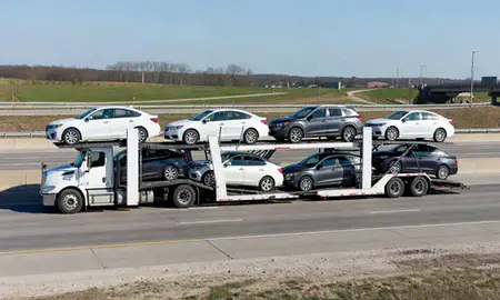 Multi-level car carrier on the highway to Bloomington, Indiana, United States