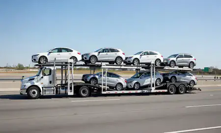 Multi-level car carrier on the highway to Columbus, Indiana, United States