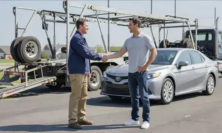 Vehicle owner beside their delivered car in Columbus, Indiana, United States