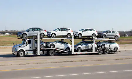 Multi-level car carrier on the highway to Evansville, Indiana, United States