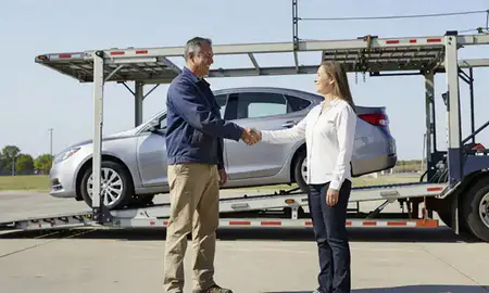 Vehicle owner beside their delivered car in Evansville, Indiana, United States