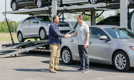 Vehicle owner beside their delivered car in Fishers, Indiana, United States