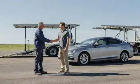 Vehicle owner beside their delivered car in Goshen, Indiana, United States