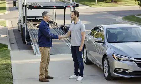 Vehicle owner beside their delivered car in Greenwood, Indiana, United States