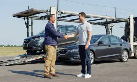 Vehicle owner beside their delivered car in Indianapolis, Indiana, United States