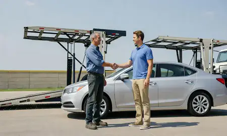 Vehicle owner beside their delivered car in New Albany, Indiana, United States