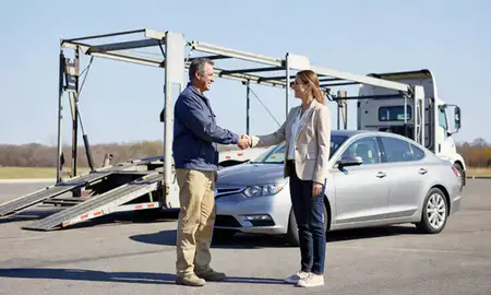Vehicle owner beside their delivered car in Portage, Indiana, United States