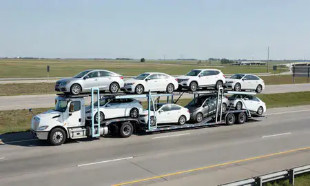 Multi-level car carrier on the highway to Terre Haute, Indiana, United States