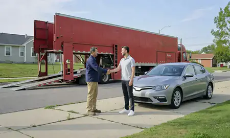 Vehicle owner beside their delivered car in West Lafayette, Indiana, United States