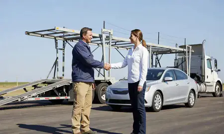 Vehicle owner beside their delivered car in Altoona, Iowa, United States
