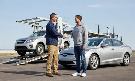 Vehicle owner beside their delivered car in Ankeny, Iowa, United States