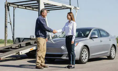 Vehicle owner beside their delivered car in Cedar Rapids, Iowa, United States