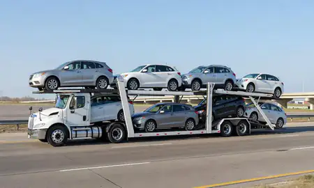 Multi-level car carrier on the highway to Clive, Iowa, United States