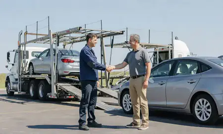 Vehicle owner beside their delivered car in Clive, Iowa, United States