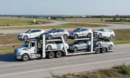 Multi-level car carrier on the highway to Fort Dodge, Iowa, United States