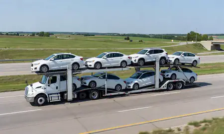 Multi-level car carrier on the highway to Indianola, Iowa, United States