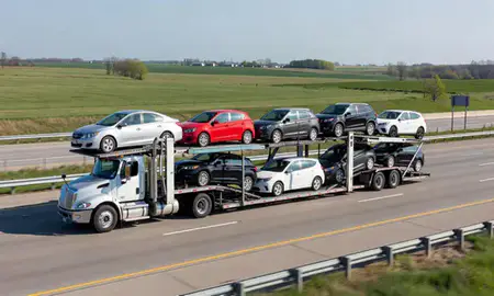 Multi-level car carrier on the highway to Iowa City, Iowa, United States