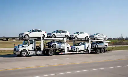 Multi-level car carrier on the highway to Johnston, Iowa, United States