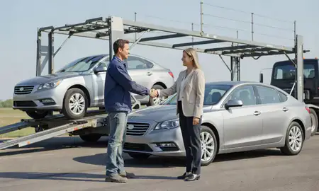 Vehicle owner beside their delivered car in Johnston, Iowa, United States