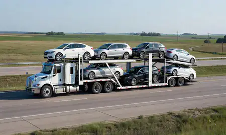 Multi-level car carrier on the highway to Marion, Iowa, United States
