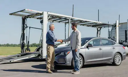 Vehicle owner beside their delivered car in North Liberty, Iowa, United States