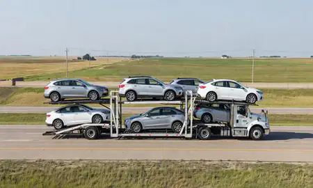 Multi-level car carrier on the highway to Andover, Kansas, United States