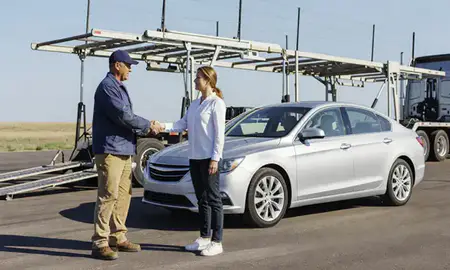Vehicle owner beside their delivered car in Andover, Kansas, United States