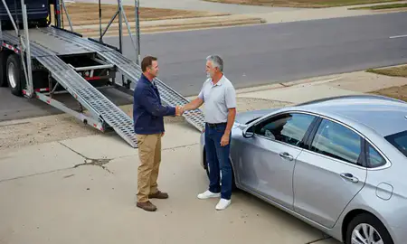 Vehicle owner beside their delivered car in Arkansas City, Kansas, United States