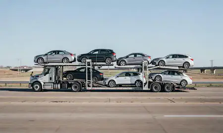 Multi-level car carrier on the highway to Derby, Kansas, United States