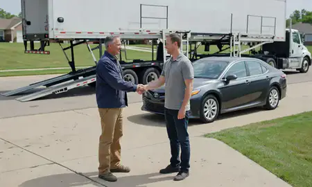 Vehicle owner beside their delivered car in Derby, Kansas, United States