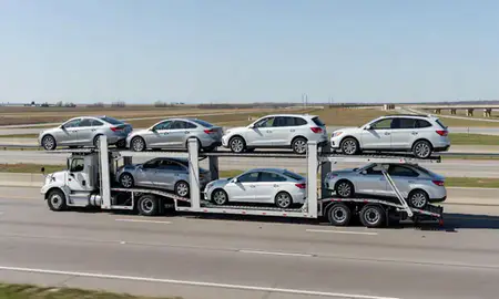 Multi-level car carrier on the highway to Emporia, Kansas, United States