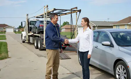 Vehicle owner beside their delivered car in Emporia, Kansas, United States