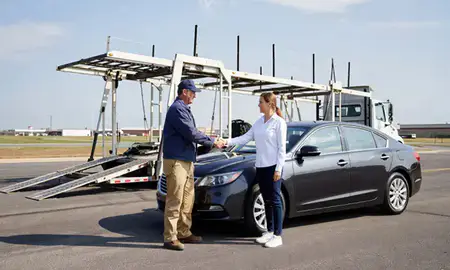 Vehicle owner beside their delivered car in Gardner, Kansas, United States