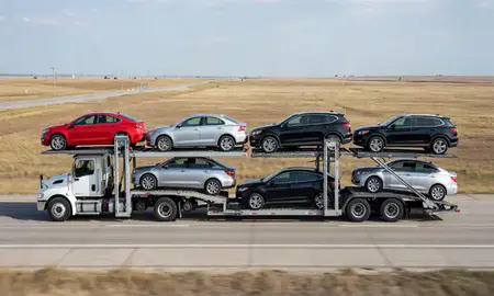 Multi-level car carrier on the highway to Hays, Kansas, United States