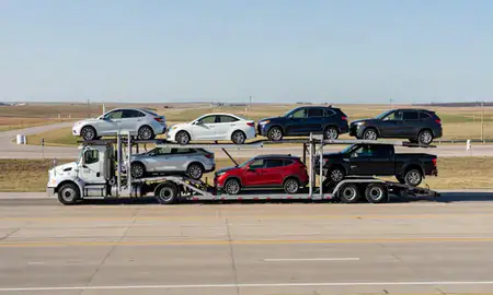 Multi-level car carrier on the highway to Hutchinson, Kansas, United States