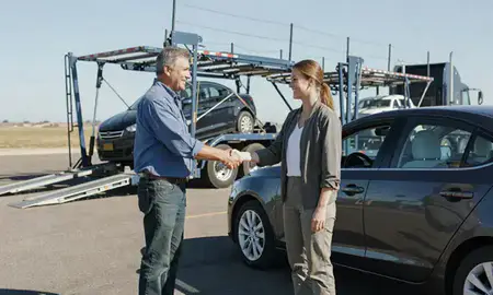Vehicle owner beside their delivered car in Hutchinson, Kansas, United States