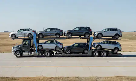 Multi-level car carrier on the highway to Junction City, Kansas, United States