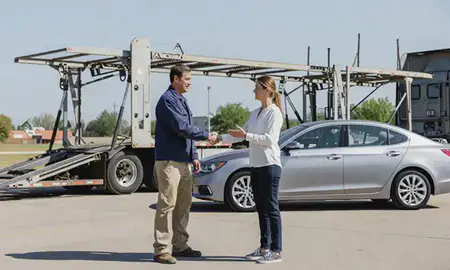Vehicle owner beside their delivered car in Kansas City, Kansas, United States
