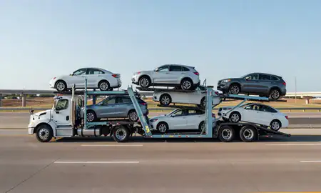 Multi-level car carrier on the highway to Lawrence, Kansas, United States