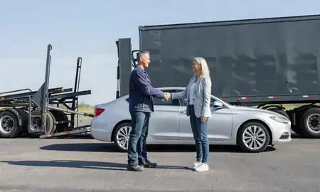 Vehicle owner beside their delivered car in Lawrence, Kansas, United States