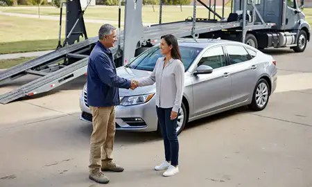 Vehicle owner beside their delivered car in Lenexa, Kansas, United States