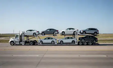 Multi-level car carrier on the highway to Liberal, Kansas, United States