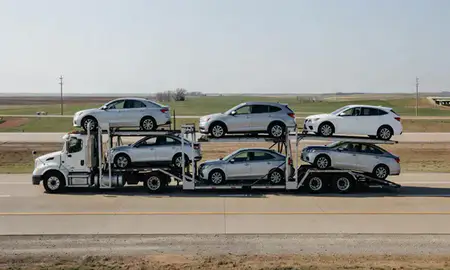 Multi-level car carrier on the highway to Newton, Kansas, United States