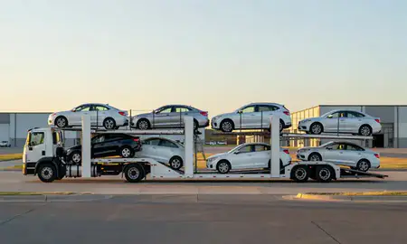Car transporter parked in an industrial area of Newton, Kansas, United States