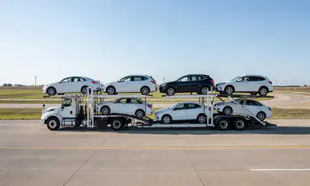 Multi-level car carrier on the highway to Olathe, Kansas, United States